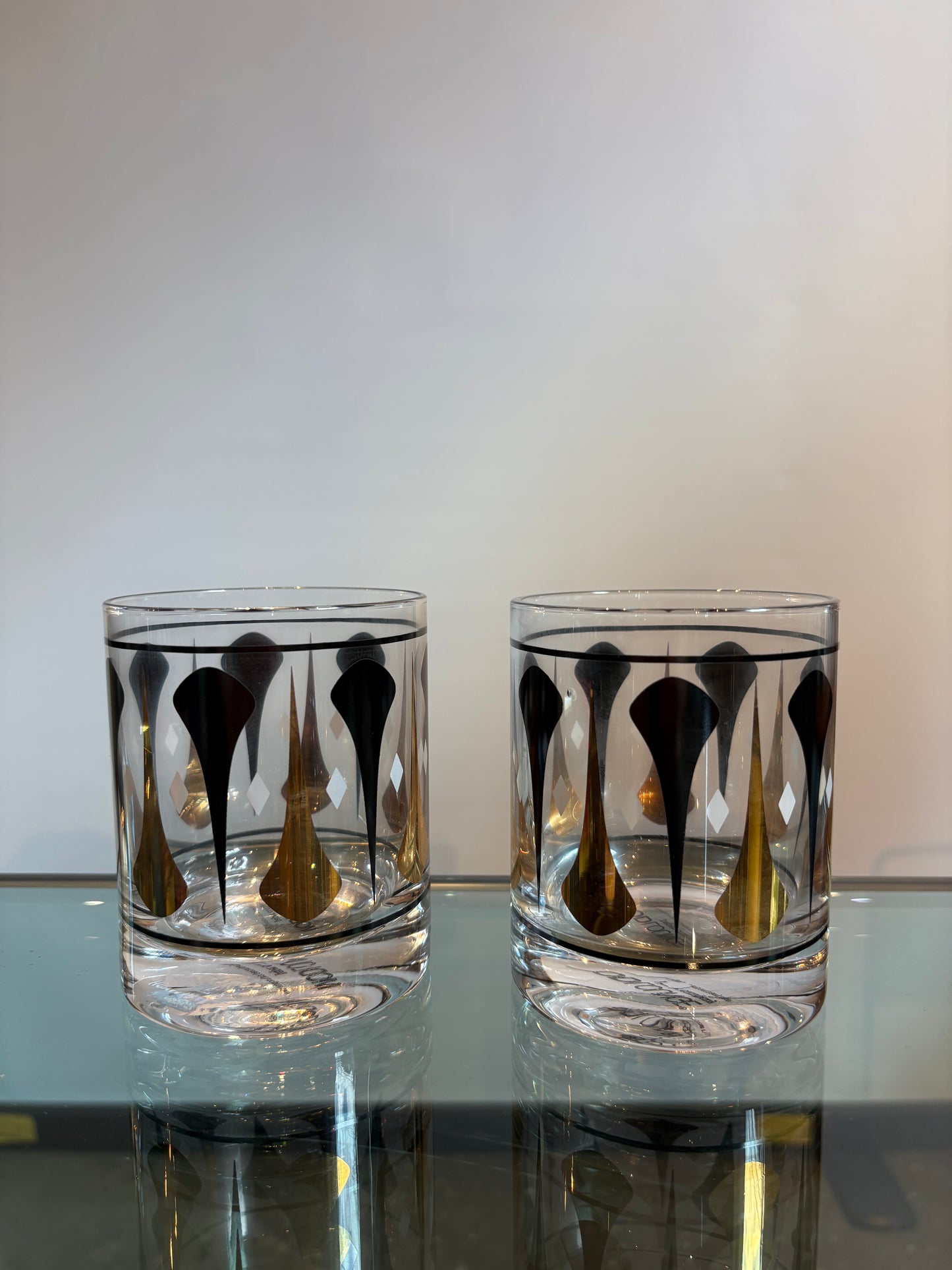 2 BLK AND GOLD MCM WHISKEY